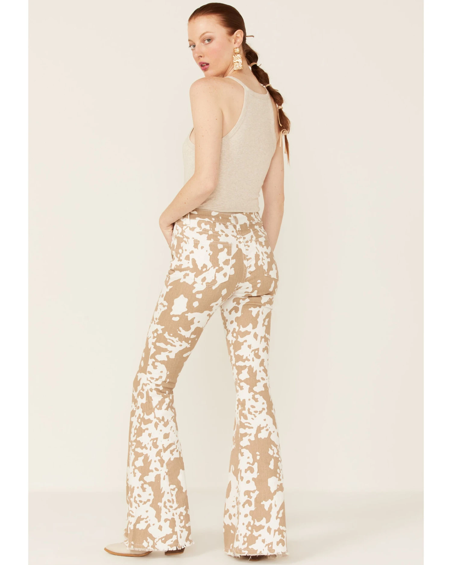 Saints & Hearts Women's Cow Print High Rise Raw Hem Flare Jeans - Image 3